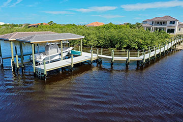 Dock on intracoastal custom home by Stoughton & Duran
